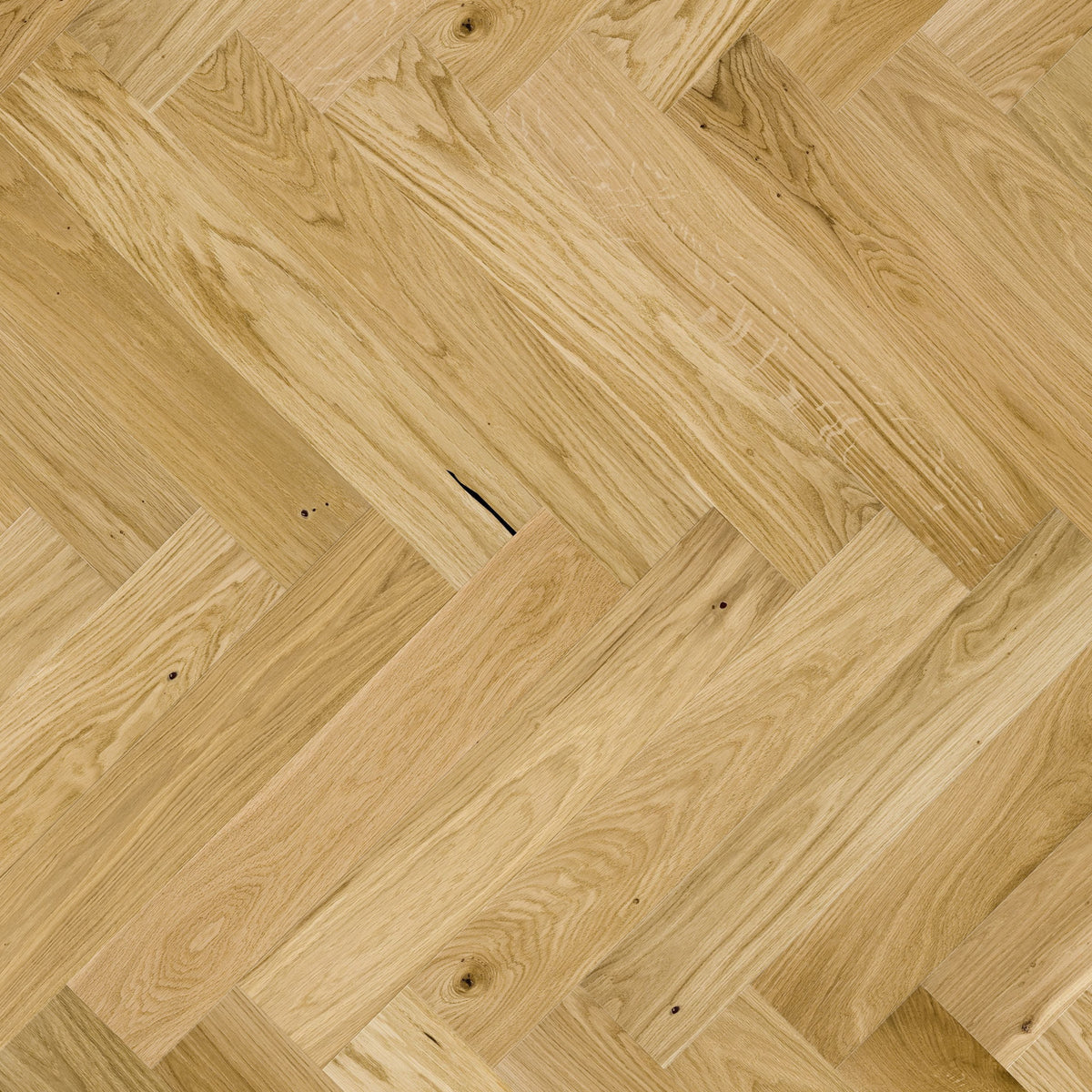quality natural wood flooring laid in herringbone pattern