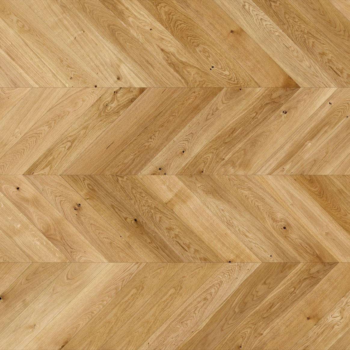 Natural wood flooring laid in chevron pattern